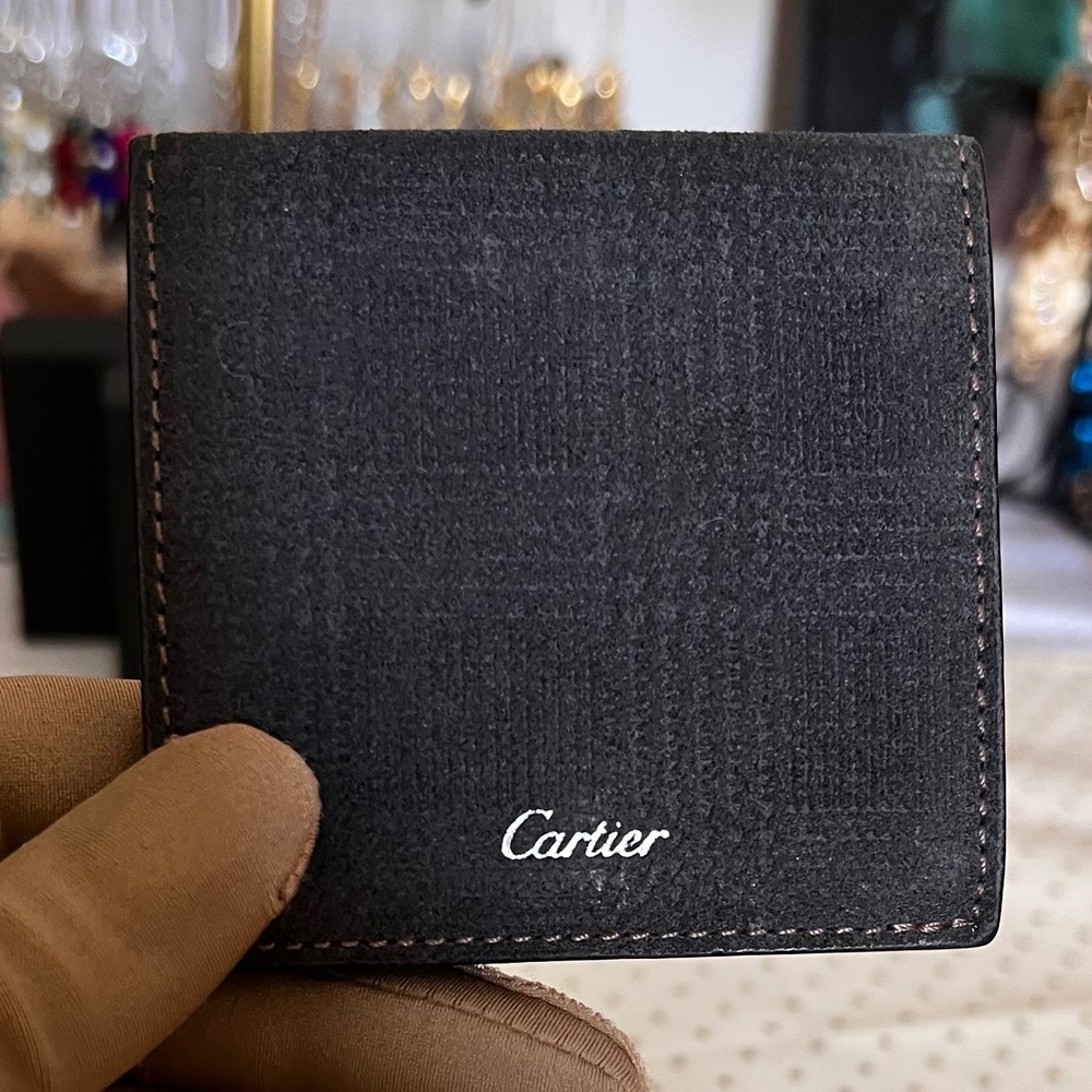 CARTIER Square “fold out” leather accessory with suede texture.